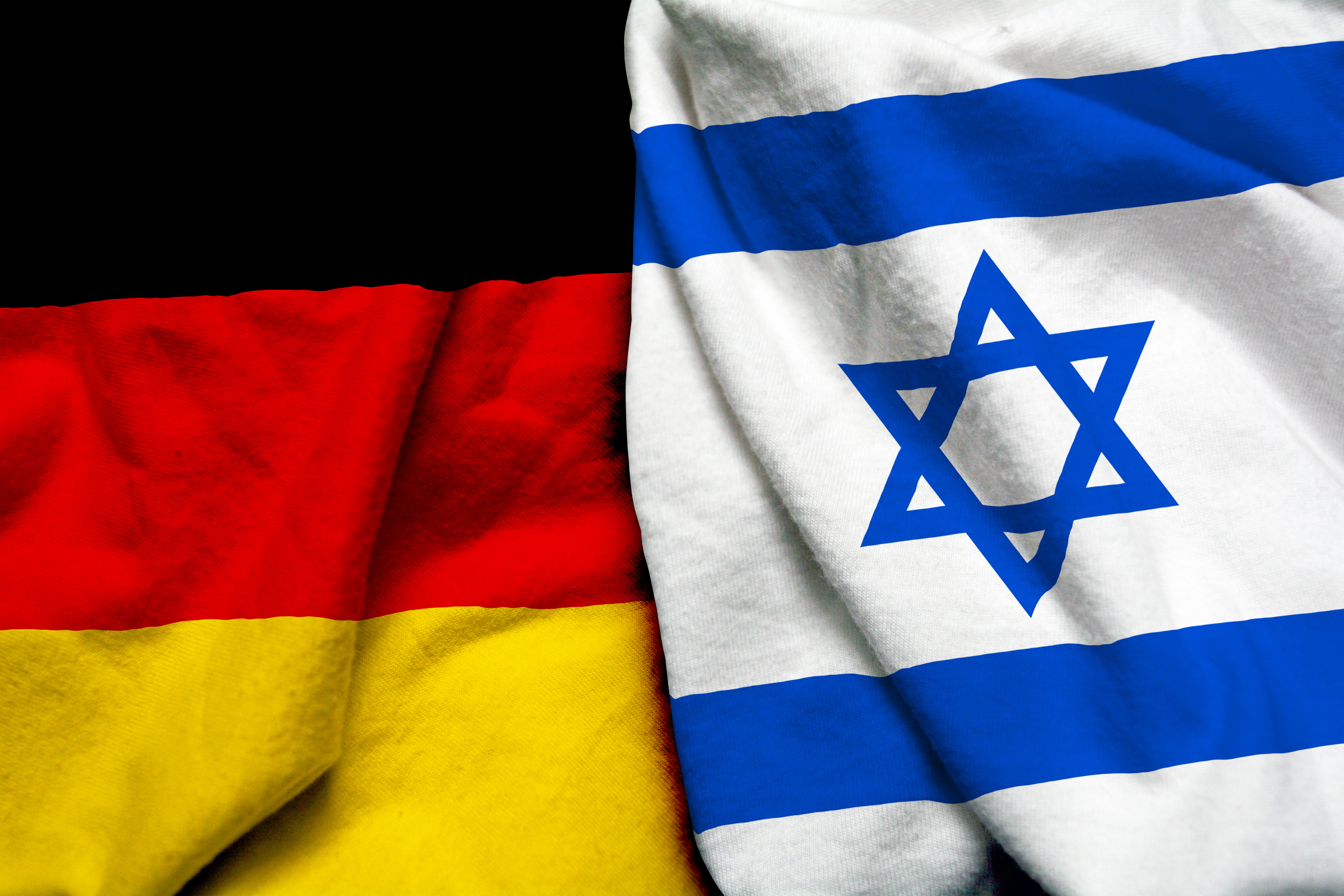 Флаг Израиля и Германии, куда можно переехать по еврейской линии