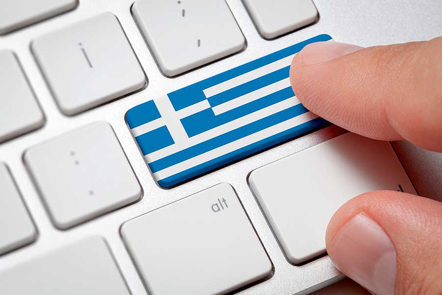 Клавиатура и флаг Греции, работа в которой доступна для русских